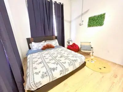 a bedroom with a bed with purple curtains at Cozy95#6pax#Netflix#SukunBukitMertajam in Bukit Mertajam