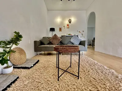 a living room with a couch and a table at Cozy95#6pax#Netflix#SukunBukitMertajam in Bukit Mertajam
