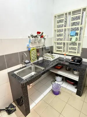 a kitchen with a sink and a counter top at AYAAN CLUB HOUSE Free WiFI & Netflix in Cameron Highlands