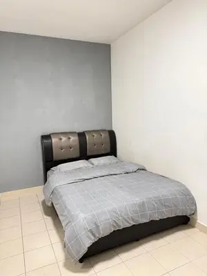 a bedroom with a bed with a black headboard at AYAAN CLUB HOUSE Free WiFI & Netflix in Cameron Highlands