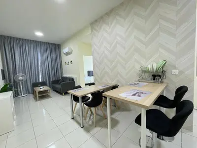 a living room with a table and chairs at The Anderson Ipoh Town in Ipoh