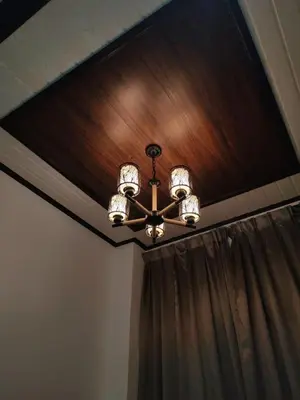 a ceiling light with a chandelier and a curtain at Khoo Family Villa in Ipoh
