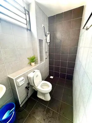 a bathroom with a toilet and a sink at Lapang Tuju Private Pool Homestay in Sungai Petani