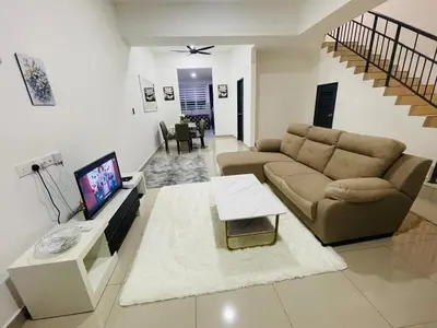 a living room with a couch and a table at Gaya's Homestay Sri Klebang in Ipoh