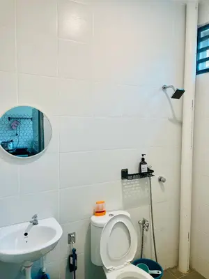a bathroom with a toilet and a sink at Cozy Home Aman Selesa Netflix Wifi Usm in Parit Buntar