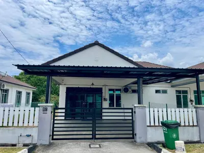 a white house with a gate and a fence at Cozy Home Aman Selesa Netflix Wifi Usm in Parit Buntar