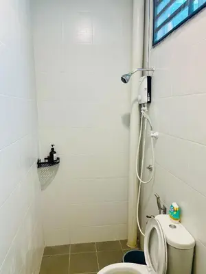 a bathroom with a toilet and a shower at Cozy Home Aman Selesa Netflix Wifi Usm in Parit Buntar