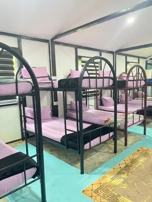 a group of bunk beds in a room at Belibis Yard in Kampar