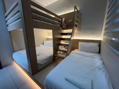 two bunk beds in a small room at PrimaStay Ipoh Palo for 7 Pax in Ipoh