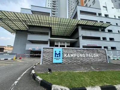 a building with a sign in front of it at PrimaStay Ipoh Palo for 7 Pax in Ipoh