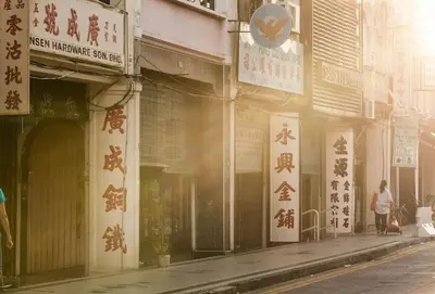 a building with asian writing on the side of a street at sea city cozy familystay 3br 10 pax in George Town