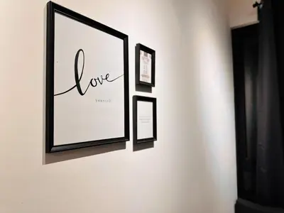 three framed pictures hanging on a wall at Classic House In Georgetown 3br 10pax in George Town
