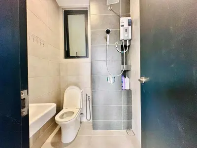 a bathroom with a toilet and a shower in it at Island Sea & City View Familystay 3BR 10Pax in George Town