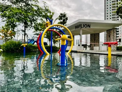a fountain in a pool of water in a city at Peaceful Abode Familystay 3 br 10 pax in George Town