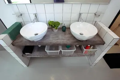 two sinks on a wooden counter in a bathroom at Stay SongSong Mount Erskine in George Town