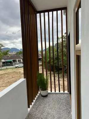 a potted plant sitting on the front door of a house at Hillview Bercham Height CoLiving Villa in Ipoh