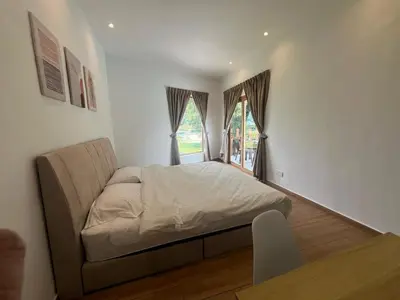 a bedroom with a bed and a window at Hillview Bercham Height CoLiving Villa in Ipoh