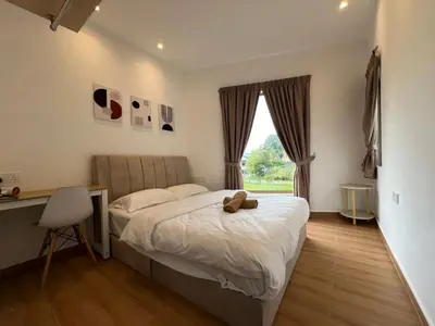 a bedroom with a bed with a teddy bear on it at Hillview Bercham Height CoLiving Villa in Ipoh
