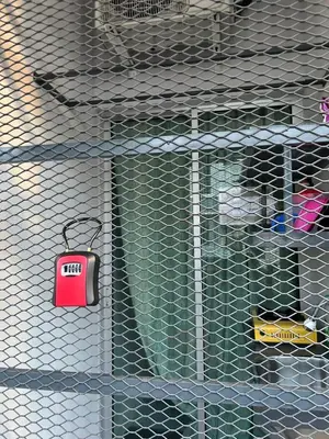 a metal cage with a red tag on it at comfy soho in Seri Iskandar