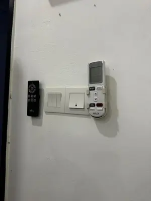 an electronic device is attached to a wall at comfy soho in Seri Iskandar