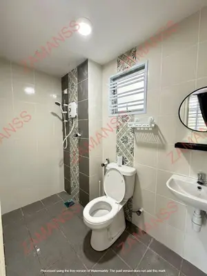 a bathroom with a toilet and a sink at zamanss homestay in Kampong Simee