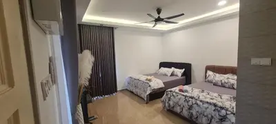 a living room with a couch and a ceiling fan at CBHResort Agrofarm in Baling