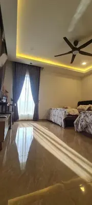 a bedroom with a bed and a ceiling fan at CBHResort Agrofarm in Baling
