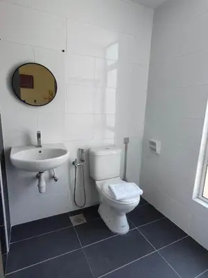 a white bathroom with a toilet and a sink at G Home 2 - Ipoh City Centre The Majestic 2R2B in Ipoh