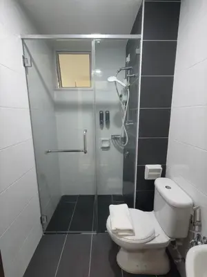 a bathroom with a shower with a toilet and a sink at G Home 2 - Ipoh City Centre The Majestic 2R2B in Ipoh