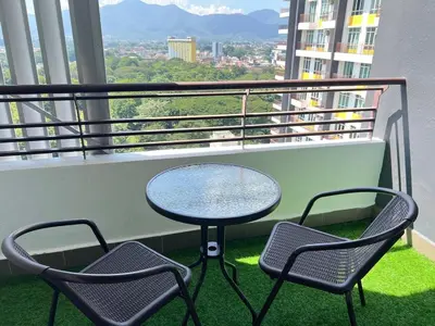 a table and two chairs on a balcony with a view at G Home 2 - Ipoh City Centre The Majestic 2R2B in Ipoh