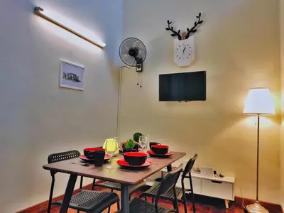 a dining room table with chairs and a tableablish at Queensbay Mall, Up to 6 Pax, 3 Bedrooms, 2 Bathrooms, 1 Car Park by Star Home in Bayan Lepas