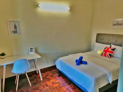 a bedroom with a bed and a desk with a toy on it at Queensbay Mall, Up to 6 Pax, 3 Bedrooms, 2 Bathrooms, 1 Car Park by Star Home in Bayan Lepas