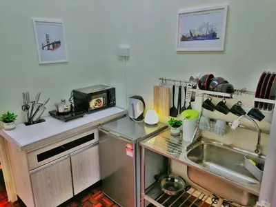 a kitchen with a sink and a counter top at Queensbay Mall, Up to 6 Pax, 3 Bedrooms, 2 Bathrooms, 1 Car Park by Star Home in Bayan Lepas