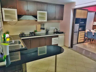 a kitchen with a sink and a counter top at Semi-Detached, Up to 24 Pax, 3200sqft, 4 Bedrooms, 3 Bathrooms, 4 Car Parks by Star Home in Gelugor