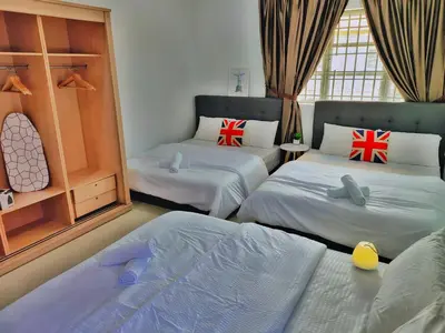 a bedroom with two beds with british flags on them at Semi-Detached, Up to 24 Pax, 3200sqft, 4 Bedrooms, 3 Bathrooms, 4 Car Parks by Star Home in Gelugor