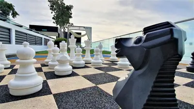 a statue of a horse playing chess on a chessboard at Near Georgetown with Beautiful city view 2 room fit 4 to 7 pax in Jelutong