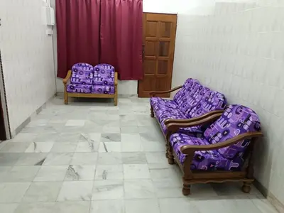 two chairs in a room with purple cushions at DeStay Trong in Terong