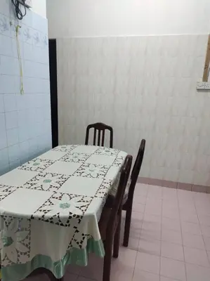 a table and chairs with a table and a tablecloth on it at DeStay Trong in Terong