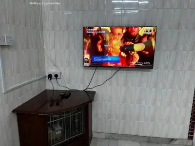 a flat screen tv hanging on a wall at DeStay Trong in Terong