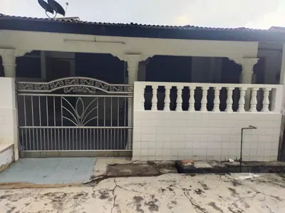 a building with a gate and a bird on top of it at DeStay Trong in Terong