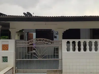 a house with a gate and a fence at DeStay Trong in Terong