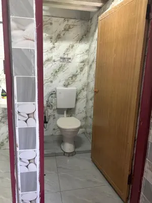 a bathroom with a toilet in a room at Chengai homestay in Sungkai