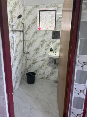 a bathroom with a shower and a sink at Chengai homestay in Sungkai