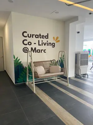 a swing in a room with a sign on the wall at Lavender Villa Marc Residence Bukit Mertajam in Bukit Mertajam