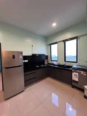 a kitchen with a stainless steel refrigerator and windows at Lavender Villa Marc Residence Bukit Mertajam in Bukit Mertajam