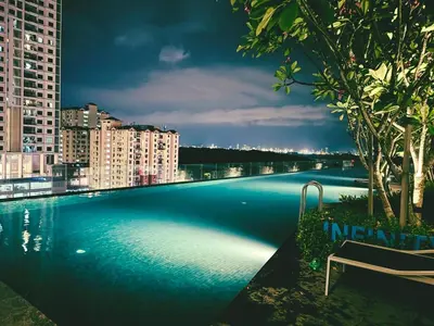 a large swimming pool on the roof of a building at Royal Luxury apartment in Georgetown 3BR 10PAX in George Town