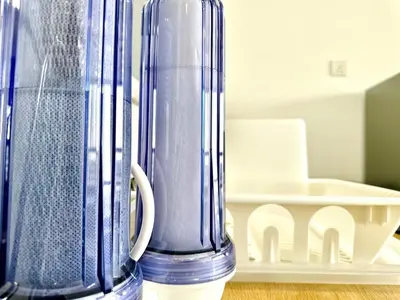 a blue vase sitting on top of a table at The society Apartment George town 3br 10 pax in George Town