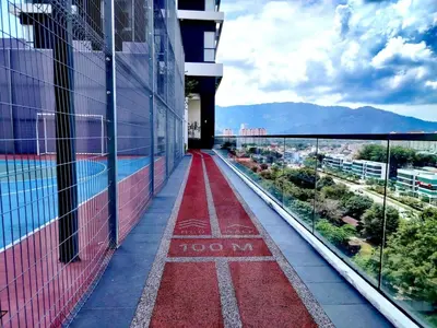 a red walkway on the side of a building at The society Apartment George town 3br 10 pax in George Town