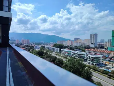 a view of a city from a building balcony at Sea & City View New Condo in Georgetown 3br 10 pax in George Town