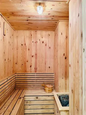 a sauna with wooden walls and a wooden floor at Classic House in Georgetown 3BR 10pax in George Town